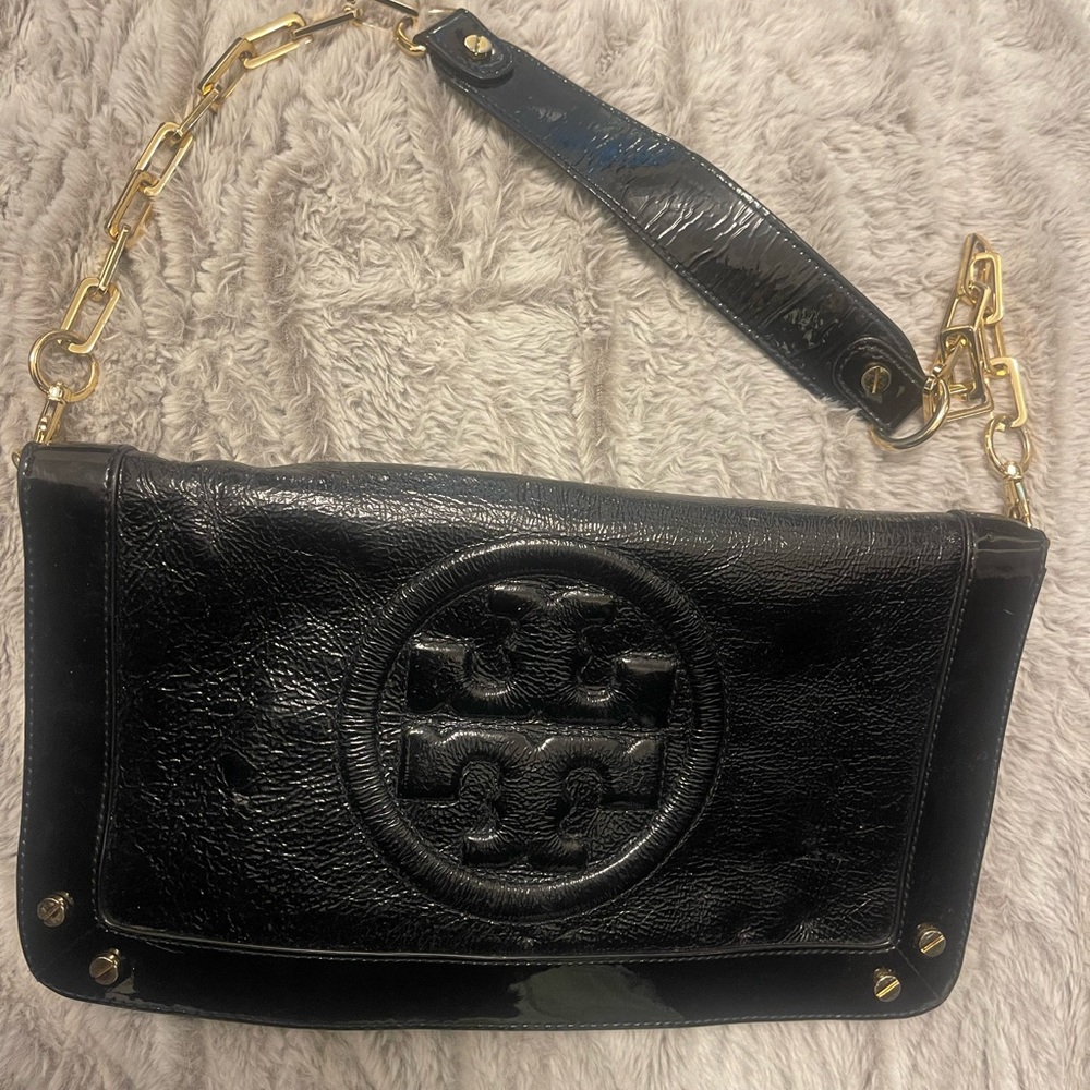 Tory Burch patent leather black clutch with signature emblem
